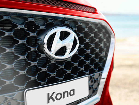 Cascading front grille with mesh pattern.